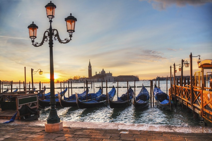 Gondolas in Venetian Lagoon at sunset