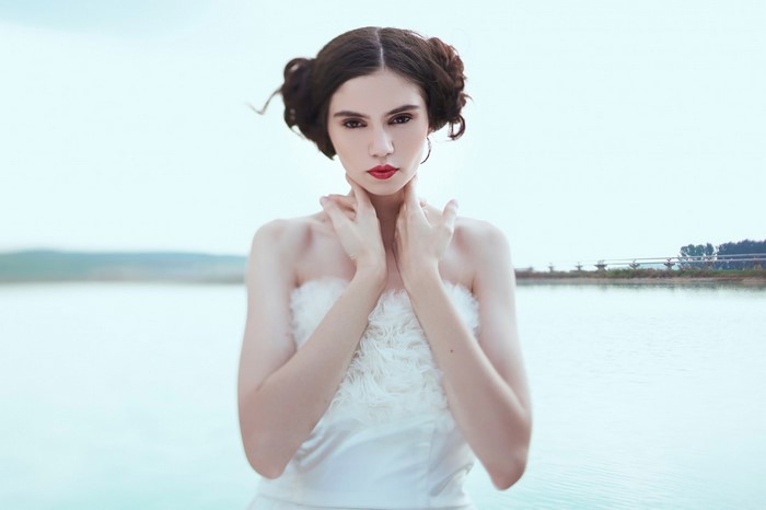 Woman with red lipstick and elaborate hairstyle