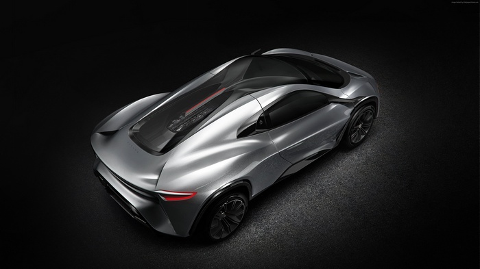 Silver concept supercar on a dark background