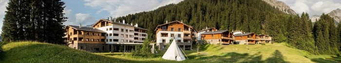 Mountain village with hotels and a teepee