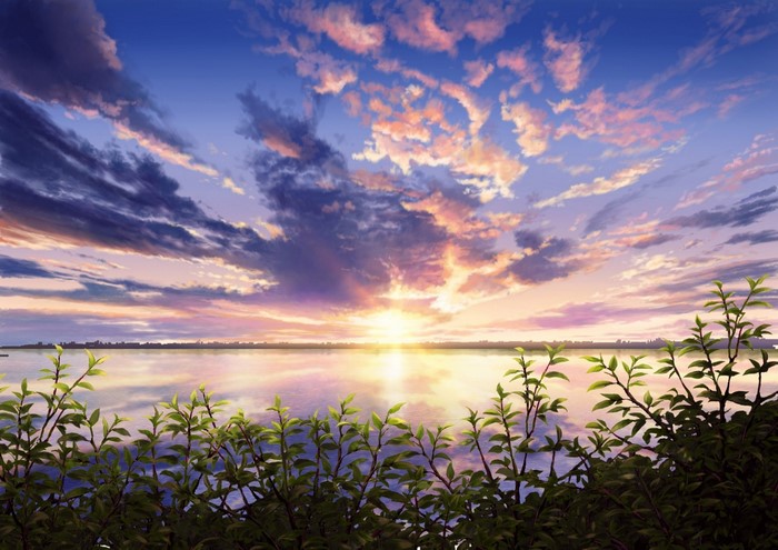 Sunset over water with clouds and foreground foliage