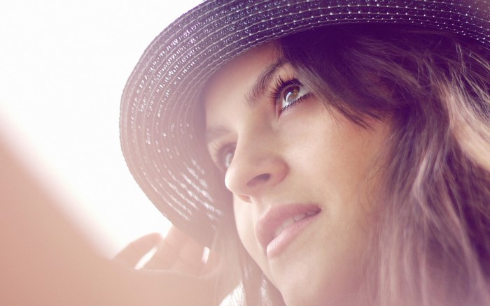 Woman wearing a hat, close-up portrait