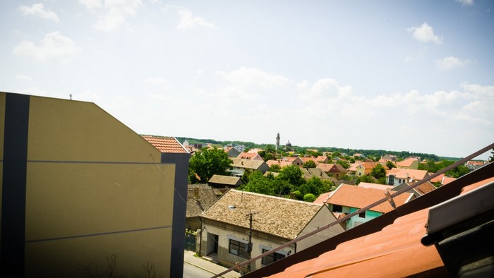View of a European town with houses and a church tower