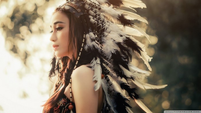 Woman wearing a Native American headdress