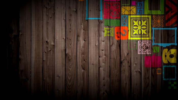Colorful geometric shapes on a wooden surface