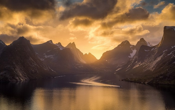 Sunset over a Fjord in Norway with Mountains and Boat