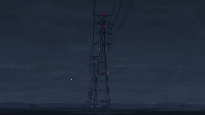 Transmission towers with red lights at night