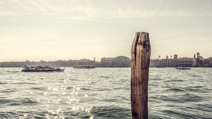 Venice canal with boats and buildings