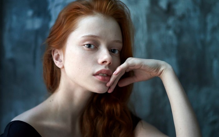 Portrait of a Redhead Woman with Long Hair