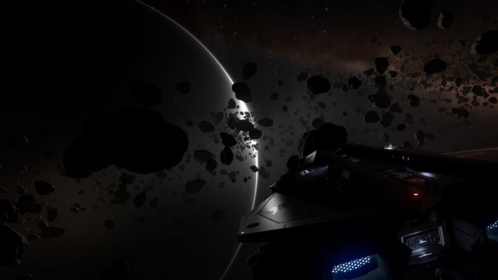 Elite Dangerous: Spaceship in an asteroid field near a planet