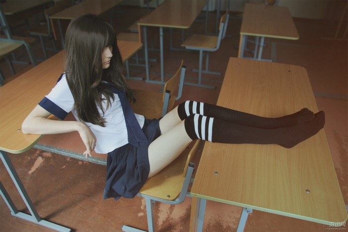 Schoolgirl in Classroom Wearing Knee High Socks