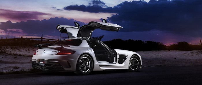 White Mercedes-Benz SLS AMG with Gullwing Doors at Dusk