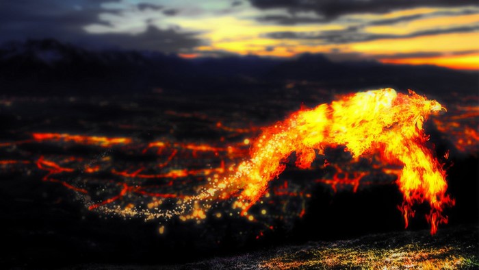 Phoenix made of fire flying over a city at sunset