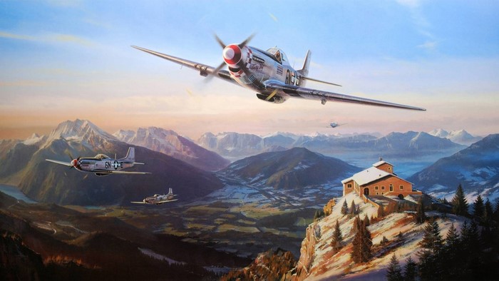 North American P-51 Mustangs flying over a snowy mountain valley