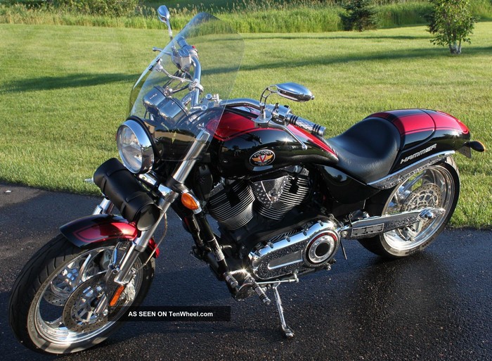 Black and red Victory Hammer motorcycle parked on asphalt