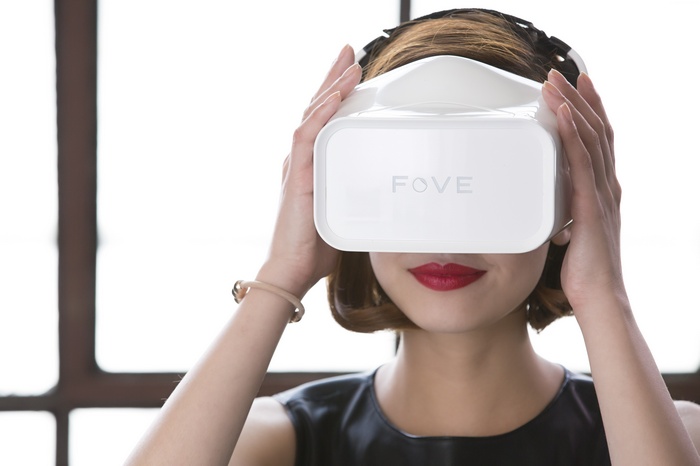 Woman wearing white Fove VR headset