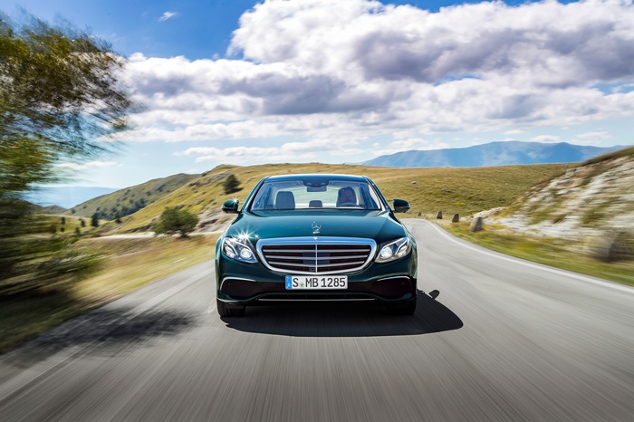 Mercedes-Benz E 350 sedan driving on a mountain road
