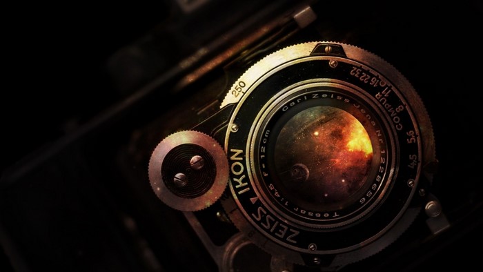 Carl Zeiss Ikon Tessar camera lens with galaxy reflection