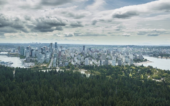 Aerial view of Vancouver cityscape with Stanley Park forest