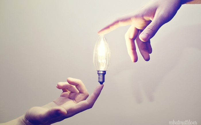 Hands and a light bulb