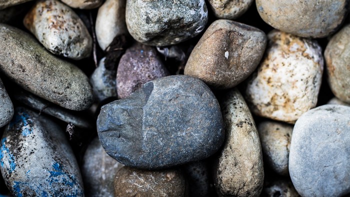 Close up of various textured rocks and pebbles