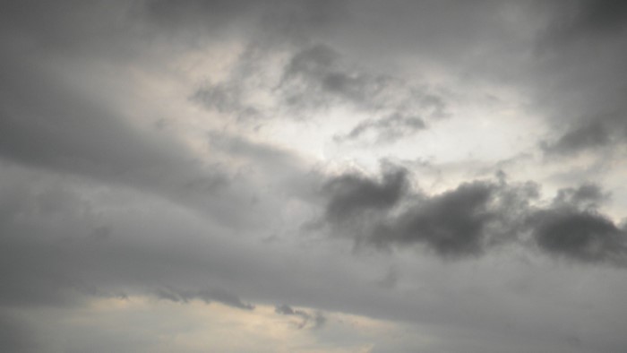 Stormy sky with sunlight breaking through clouds