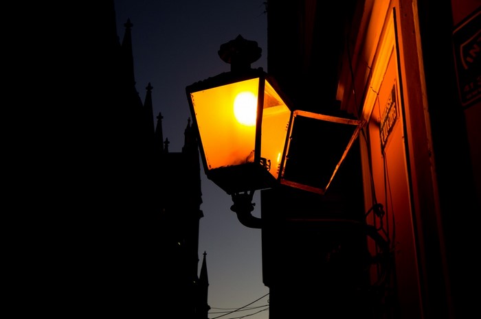 Street lamp with yellow light at night
