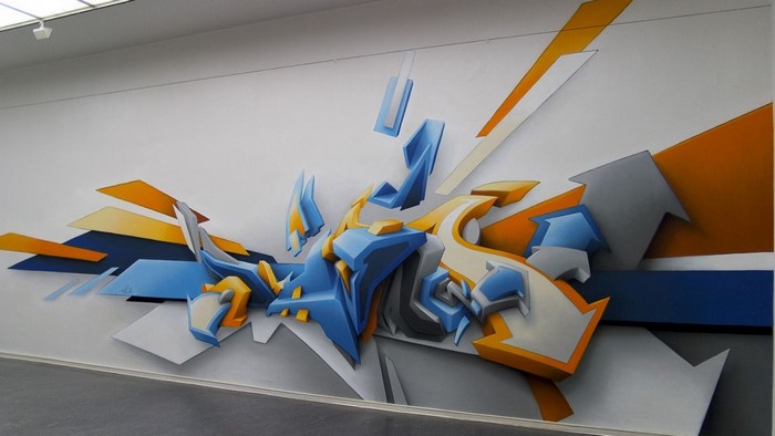 Graffiti art with abstract 3D elements in blue and orange
