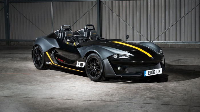Black Zenos E10 R sports car with yellow stripe