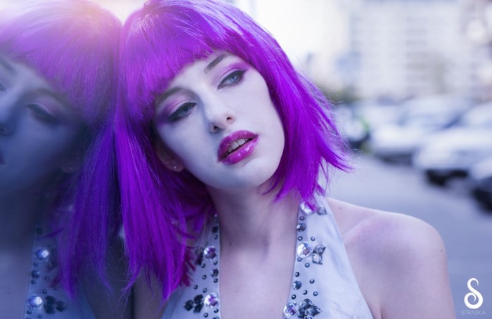 Woman with purple wig and makeup