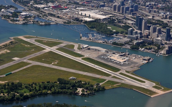 Toronto Island Airport with city skyline and marina