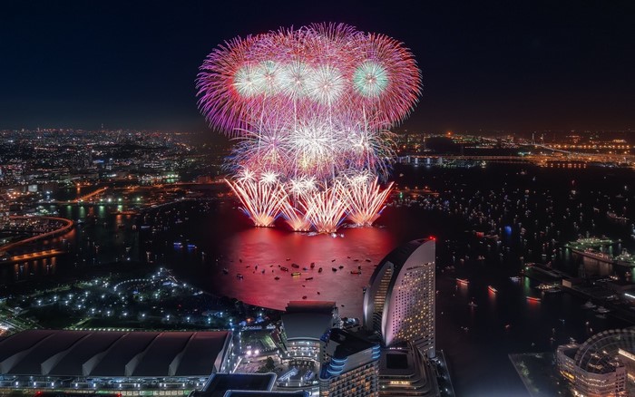 Fireworks over a city at night
