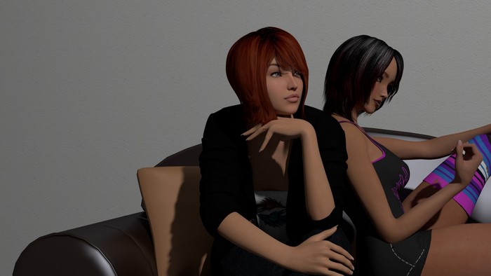 Two women sitting on a couch