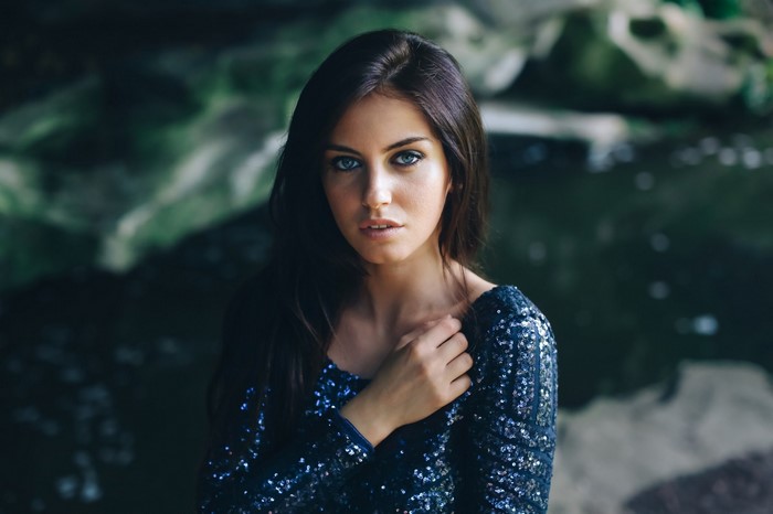 Portrait of Woman with Blue Eyes in Sparkling Dress