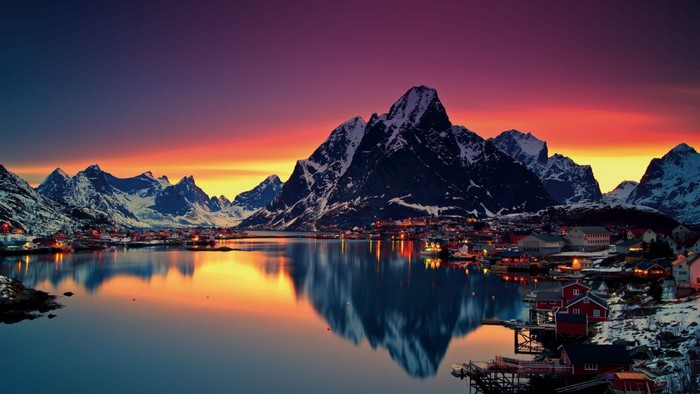 Mountains reflecting in a lake at sunset in Lofoten, Norway