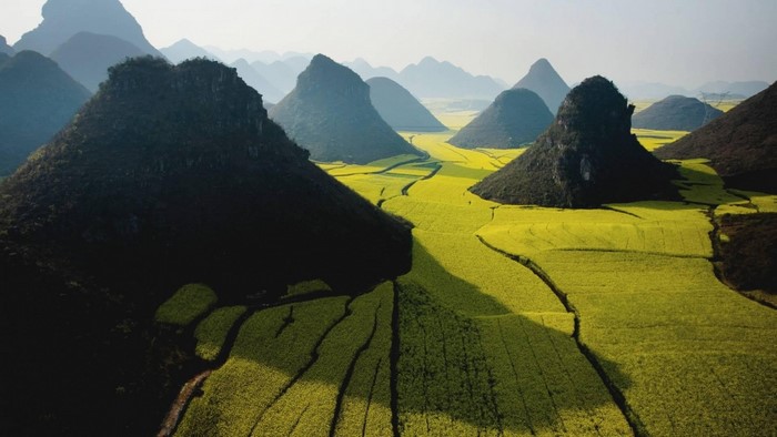 Karst mountains and yellow rapeseed fields