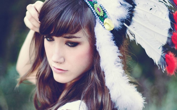 Woman wearing a Native American headdress