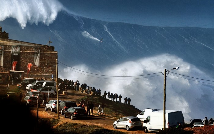 Surfer rides giant wave in Nazaré, Portugal