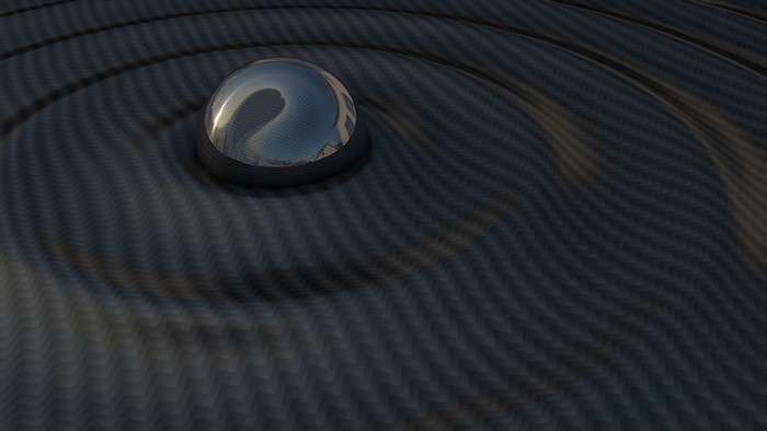 Abstract carbon fiber surface with a reflective sphere