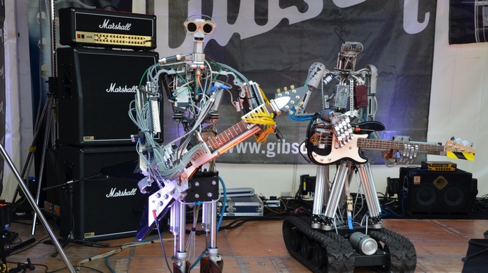 Compressorhead robots playing guitars and bass