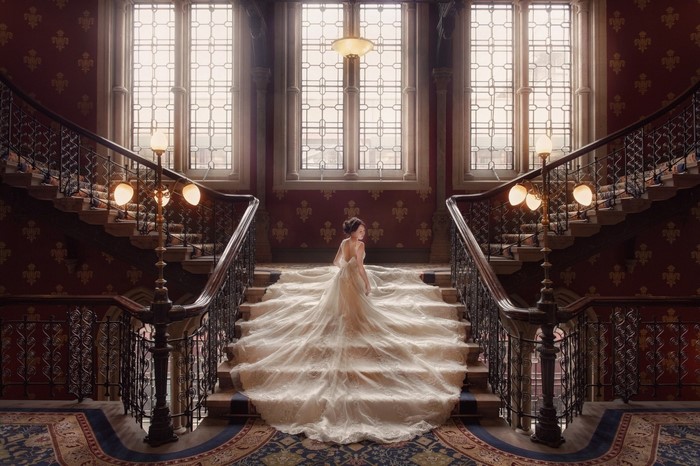 Woman in a wedding dress on a grand staircase