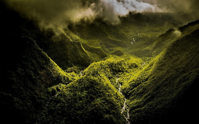 Aerial view of a misty valley with a river
