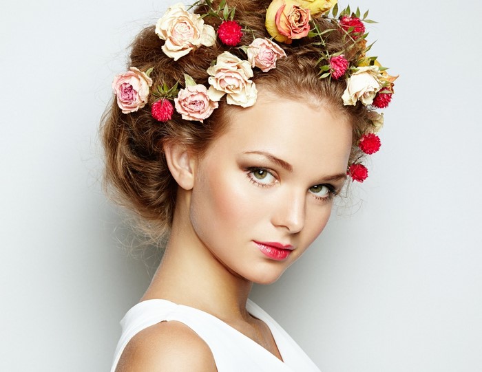 Woman with flowers in her hair and white dress