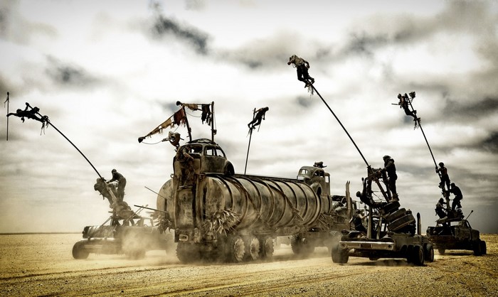 War Rig convoy with people on poles in Mad Max Fury Road