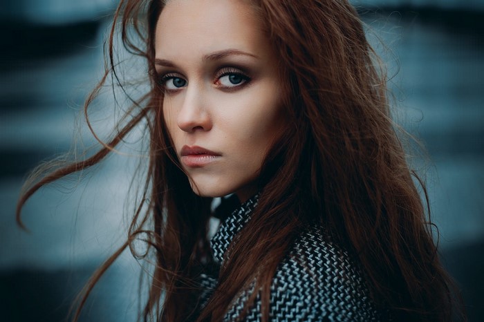 Woman with long brown hair and makeup