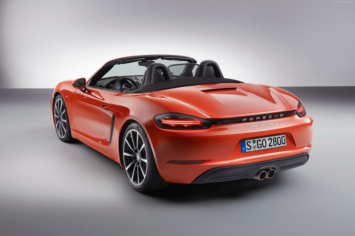 Orange Porsche 718 Boxster S convertible sports car