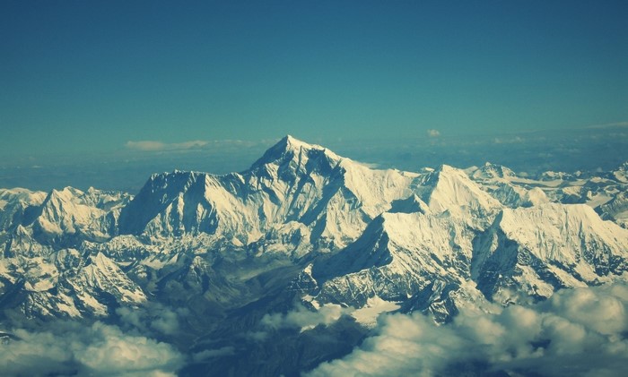 Snow-capped mountains under a clear blue sky