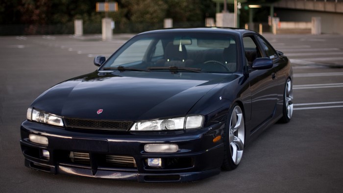 Dark blue Nissan Silvia S14 Kouki parked in a lot
