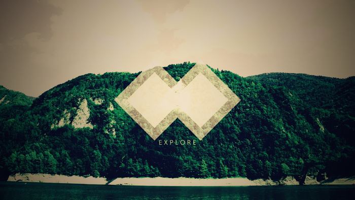 Geometric shapes over a mountain landscape with the word EXPLORE