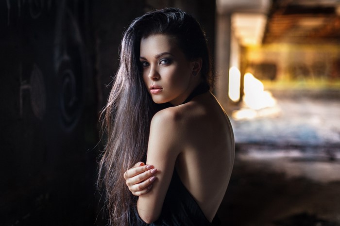 Portrait of Woman with Long Hair in Dark Setting